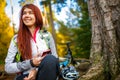 Image of happy woman with cellular phone in autumn forest Royalty Free Stock Photo