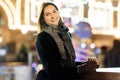 Image of happy woman in city at evening on blurred background Royalty Free Stock Photo