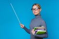 Image of happy woman teacher with pointer and books in hands Royalty Free Stock Photo