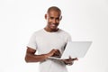 Happy young african man using laptop computer Royalty Free Stock Photo