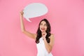 Happy young asian woman holding speech bubble. Royalty Free Stock Photo