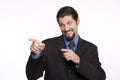 Image of a happy young businessman pointing away Royalty Free Stock Photo