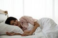 Image of happy young pretty lady lying on bed Royalty Free Stock Photo