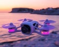 image has produced an image of a white drone in flight above the ocean at sunset, with mountains in the background Royalty Free Stock Photo