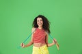 Image of healthy woman 20s wearing summer clothes working out and doing exercises with jumping rope Royalty Free Stock Photo