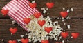 Image of heart icons over box of popcorn Royalty Free Stock Photo