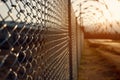 An image of a high-security prison fence or perimeter wall, symbolizing the separation between inmates and the outside world.