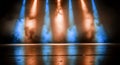 Dramatic Spotlights Casting Warm and Cool Tones on a Glossy Stage Floor Creating an Atmospheric and Cinematic. Royalty Free Stock Photo