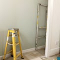 Home Improvement ladder paint can and paint roller