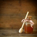 Image of honey glass jar. rosh hashanah (jewish holiday) concept. traditional holiday symbols.