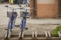 Image of two blue bicycles with black iron basket Royalty Free Stock Photo