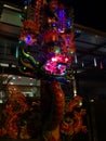 The huge unburned joss stick light up the night scene outside the house.