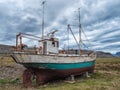 Icelandic fishing boat used as a vehicle for finding fish parket on the beach Royalty Free Stock Photo