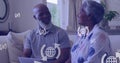 Image of icons over happy senior african american couple sitting on sofa