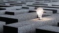 The image of an illuminated lightbulb in a complex maze represents problem solving and creative thinking Royalty Free Stock Photo
