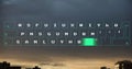 Image of illuminated pattern moving on keyboard over modern buildings against scenic sky Royalty Free Stock Photo