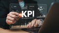 KPI Key Performance Indicators Data Visualization with Hand Pointing on Screen and Laptop in Background Showing Business Growth Royalty Free Stock Photo