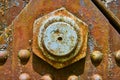 Industrial background asset old rusty bright blue bolt with rivets and corroding metal flecks Royalty Free Stock Photo