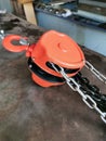 Image of industrial manual chain hoist on the table.