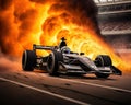 The Indy 500 race car is burning with smoke coming from its back. Royalty Free Stock Photo