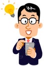 Inspirational expression of a businessman wearing glasses operating a smartphone