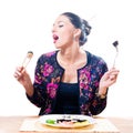 Image of isolated on white background beautiful seductive brunette woman eating sushi with chopsticks and fork Royalty Free Stock Photo