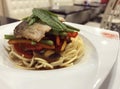 Image of italian spaghetti with fish and chives beans, tomato and paprika