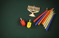 image of jewish holiday Hanukkah with wooden decorative menorah (traditional Candelabra) and wooden dreidels spinning top Royalty Free Stock Photo