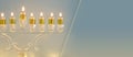 image of jewish holiday Hanukkah background with crystal menorah & x28;traditional candelabra& x29; and candles. Royalty Free Stock Photo