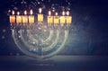 image of jewish holiday Hanukkah background with crystal menorah (traditional candelabra) Royalty Free Stock Photo