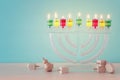 image of jewish holiday Hanukkah background with crystal menorah (traditional candelabra) Royalty Free Stock Photo