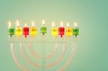 image of jewish holiday Hanukkah background with crystal menorah (traditional candelabra) Royalty Free Stock Photo