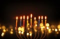 image of jewish holiday Hanukkah background with menorah & x28;traditional candelabra& x29; and burning candles Royalty Free Stock Photo