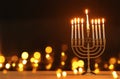 image of jewish holiday Hanukkah background with menorah & x28;traditional candelabra& x29; and candles. Royalty Free Stock Photo