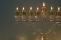 image of jewish holiday Hanukkah background with traditional spinnig top, doughnuts and menorah