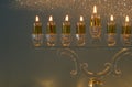image of jewish holiday Hanukkah background with traditional spinnig top, doughnuts and menorah Royalty Free Stock Photo