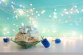 Image of jewish holiday Hanukkah with doughnut with marshmallow and wooden dreidels (spinning top Royalty Free Stock Photo