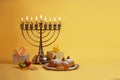 Image of Jewish holiday Hanukkah with menorah donuts and wooden dreidels doughnut, chocolate coins Royalty Free Stock Photo