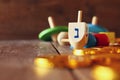 Image of jewish holiday Hanukkah with wooden dreidels Royalty Free Stock Photo