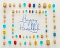 Image of jewish holiday Hanukkah with wooden dreidels colection & x28;spinning top& x29; over white background. Royalty Free Stock Photo