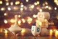 Image of jewish holiday Hanukkah with wooden dreidels colection & x28;spinning top& x29; and gold garland lights Royalty Free Stock Photo