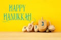 Image of jewish holiday Hanukkah with wooden dreidels & x28;spinning Royalty Free Stock Photo