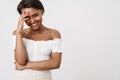 Image of joyful african american woman laughing on camera