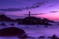 Nature Seascape with Rocks, Blurred Waves and A Lighthouse after Sunset Royalty Free Stock Photo