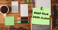 Image of keep your desk clean text on memo note over office items on tidy desk Royalty Free Stock Photo