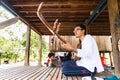 Image of a Khmer rural musician in the countryside. Music in traditional way.