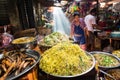 Image of a Khmer rural women in the countryside selling street food in a open market in Cambodia. Royalty Free Stock Photo