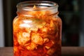 image of kimchi fermentation process in a clear glass jar