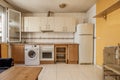 Image of kitchen front with cherry cabinets below and light cabinets above Royalty Free Stock Photo