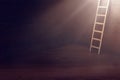 Image of ladder over dark wooden wall with light. concept of hope, faith, religion and success